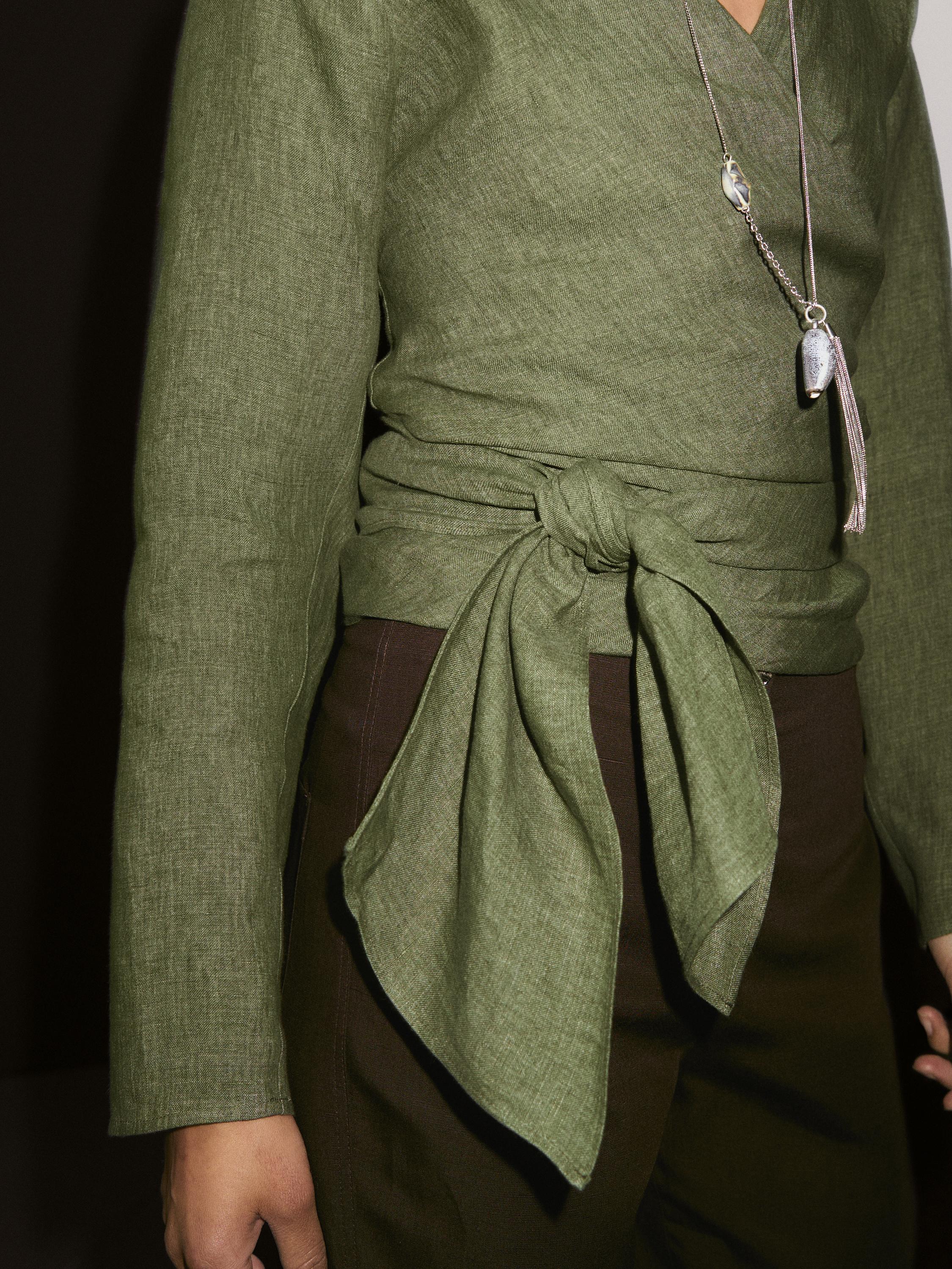 Flowing linen blouse with tie detail at the waist